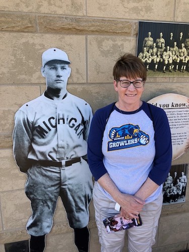 The medical school is partnering with the Kalamazoo Growlers this baseball season. Here, WMed Dean Dr. Paula Termuhlen is shown next to a cutout of Dr. Homer Stryker, the medical school's namesake.